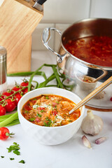 Ukrainian and Russian traditional red beet soup borsch, made from beets, cabbage, potatoes, beef and tomatoes