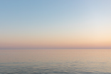Fototapeta na wymiar sunset sun by the ocean, clear water and sandy azure beach