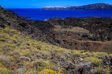 Views from volcano island Nea Kameni. Santorini - officially Thira and classic Greek Thera is an...