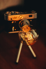 Cool night lamp with delicate yellow light as a camera