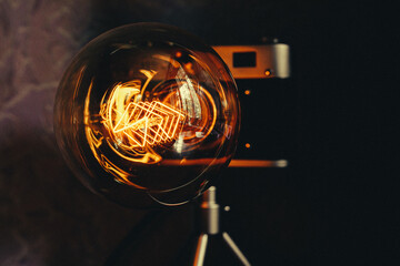 Cool night lamp with delicate yellow light as a camera