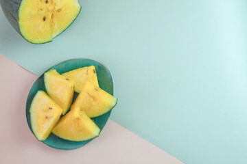 Yellow watermelon on a pink and green background.
Creative background of summer fruits. Food concept. Flat lounger, top view, copy space
Sectional seasonal fruits. Fresh fruit harvest.