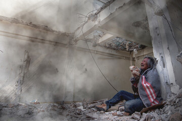 Man in an abandoned building was destroyed, crying for the loss of home destroyed by disaster or war