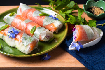 Healthy food concept Fresh smoked salmon rice paper spring rolls with colorful vegetable with copy...
