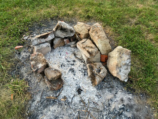Extinguished bricked fireplace in the open air - 448245559