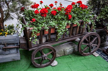 Flower bed in the form of a cart - 448245566