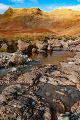 Autumn or Fall at Mickleden Beck Langdale with glacial moraine and Rossett Pike in background English Lake District