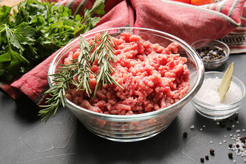 Bowl with fresh forcemeat on dark background