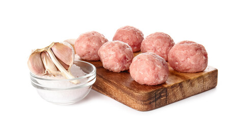 Wooden board with raw cutlets made of fresh forcemeat and ingredients on white background