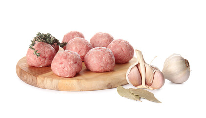 Wooden board with raw cutlets made of fresh forcemeat and spices on white background