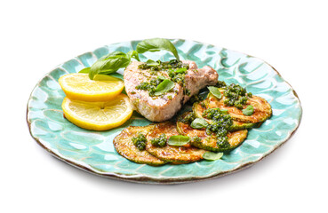 Plate with grilled zucchini, steak and pesto sauce on white background