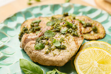 Plate with tasty steak and pesto sauce, closeup