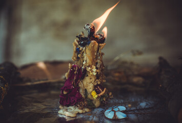 Candle burns on the altar, magic among candles, clean negative energy, wicca concept
