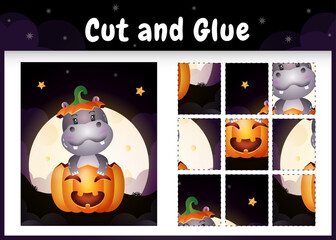 Children board game cut and glue with a cute hippo in the halloween pumpkin