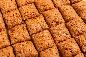 Tasty corn pillows as background, closeup