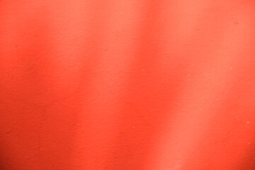 Fototapeta premium the shadow of the sun shining through the leaves, red background