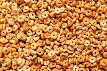 Tasty cereal rings as background, closeup