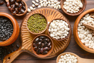 Fototapeta premium Composition with different legumes on wooden background