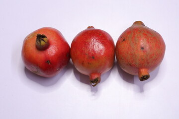 Fresh Pomegranate Fruits Isolated on White Baxkground

