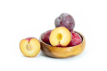 Naklejka na ściany i meble Fresh plum in wooden bowl on background, Healthy food.