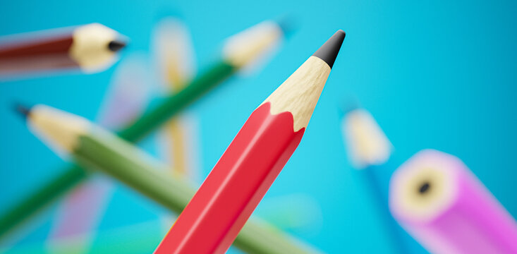 Macro shot of colored pencils on vibrant blue background. Drawing school class supplies concept