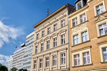 Fototapeta na wymiar the facades of historic buildings and a modern office buildings