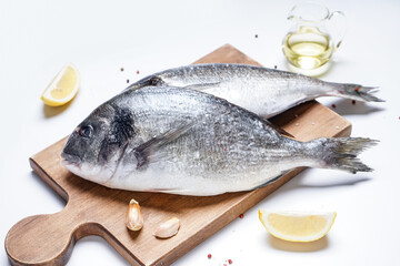 Raw dorado fishes on white background
