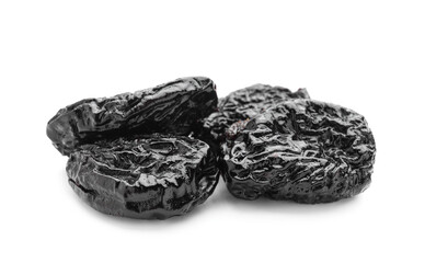 Tasty prunes on white background