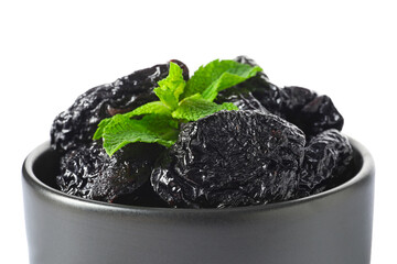 Bowl with tasty prunes on white background, closeup