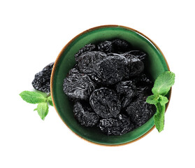 Bowl with tasty prunes on white background