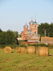 Old church and field in summer Russia