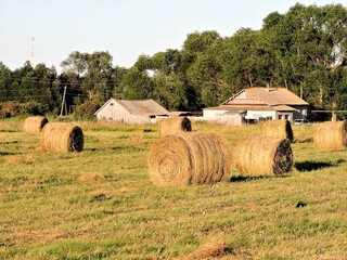 bales of hay, rural houses