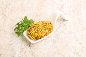 Grain mustard sauce in the bowl