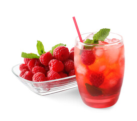 Glass of tasty lemonade and bowl with raspberry on white background
