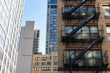 Fototapeta premium Buildings and Skyscrapers with Fire Escapes in Midtown Manhattan of New York City