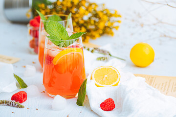 Cold drink. Orange drink with mint and fruits. Fresh drink in glass. Summer drink. Drink from beach bar. - obrazy, fototapety, plakaty