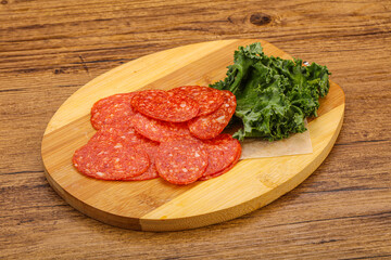 Italian spycy pepperoni sausage slices