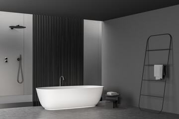 Fototapeta na wymiar Corner of dark grey bathroom space with partition, tub and shower