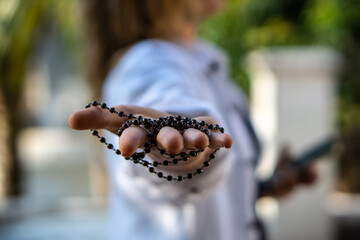Hand with black mala