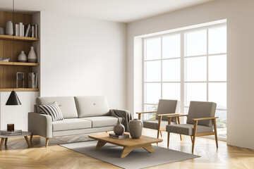 Light beige living room with sofa, armchairs and coffee tables. Corner view