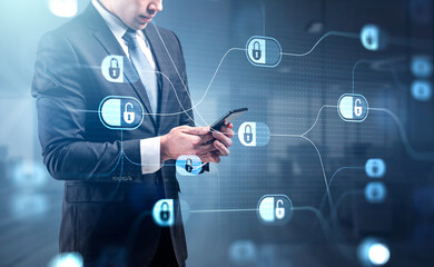 Businessman in formal suit is browsing the Internet in smartphon