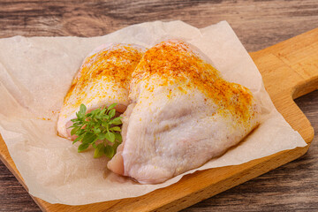 Raw chicken thigh with spices
