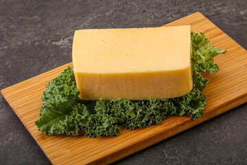 Tasty yelloow Tilsiter cheese brick