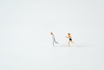 Miniature people running on oxygen level modern fingertip pulse oximeter on white background with copy space using for Healthy lifestyle and sport fitness medicine health care avoid COVID-19 concepts