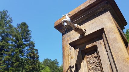 Water running from a public tap