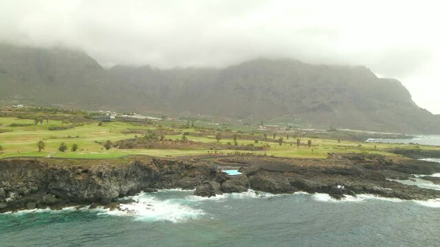 Tenerife, Buenavista del Nte. a town on the Atlantic Ocean. Sunny coast and golf course and banana plantation. Ocean, water, waves, blue ocean.