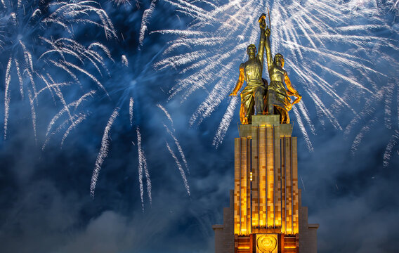 Celebratory Colorful Fireworks And Soviet Monument Rabochiy I Kolkhoznitsa ( Worker And Kolkhoz Woman Or Worker And Collective Farmer) Of Sculptor Vera Mukhina, Moscow, Russia. Made Of In 1937