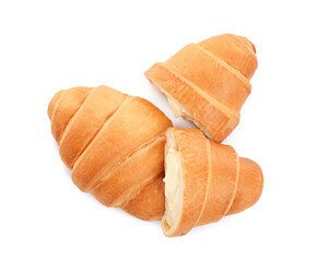 Delicious croissants with cream on white background, top view