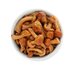 Tasty marinated mushrooms in bowl isolated on white, top view