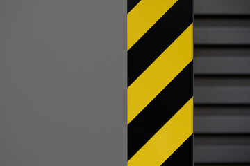 Under construction concept background. Warning or danger tape on metallic grey surface with copy...